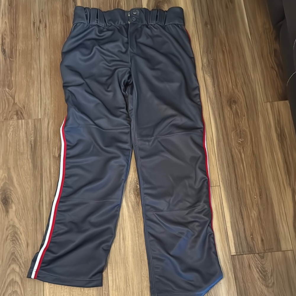 Evoshield brand. Charcoal grey athletic Pants with Red and White Stripes.